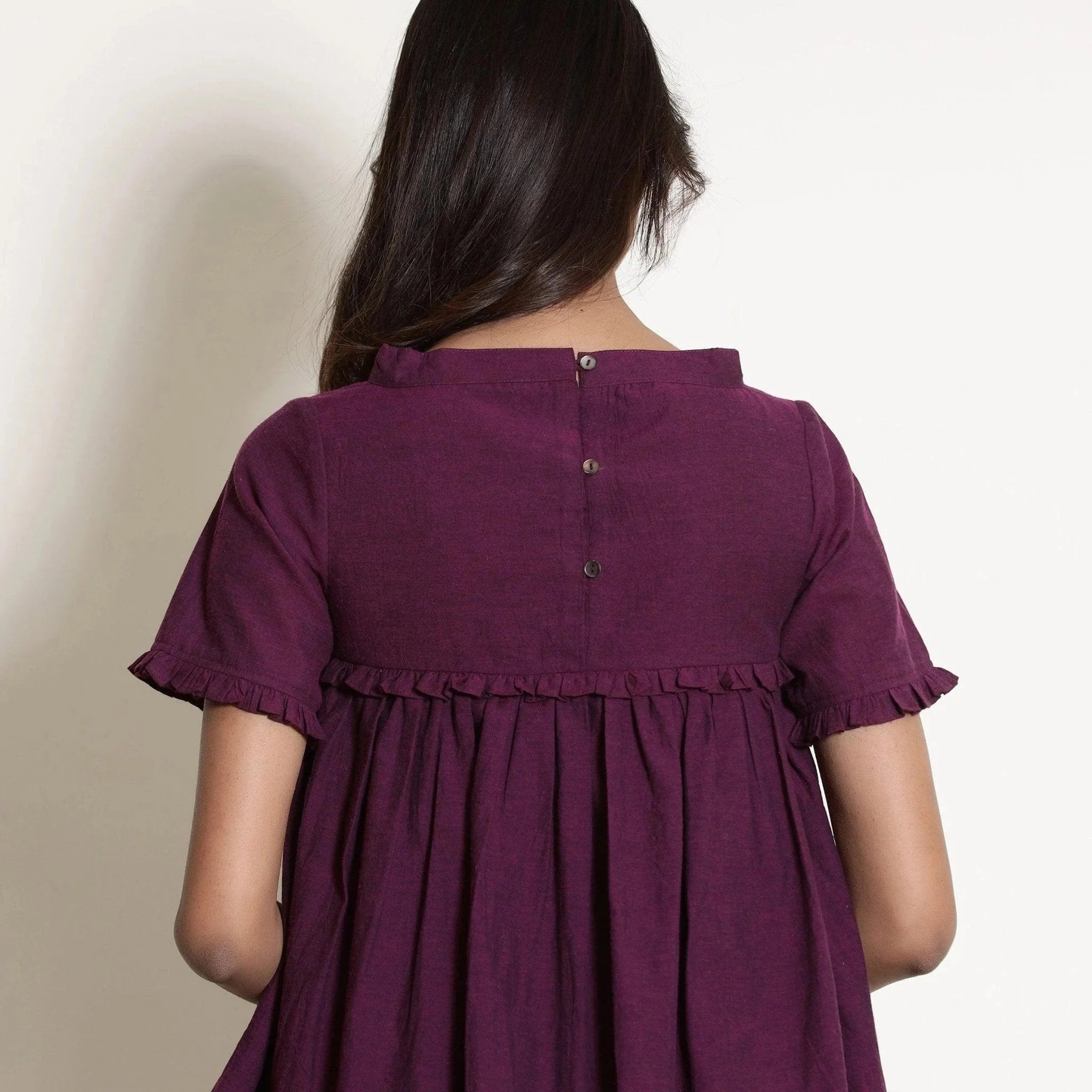 Back Detail of a Model wearing Berry Wine Warm Cotton Frilled Gathered Top