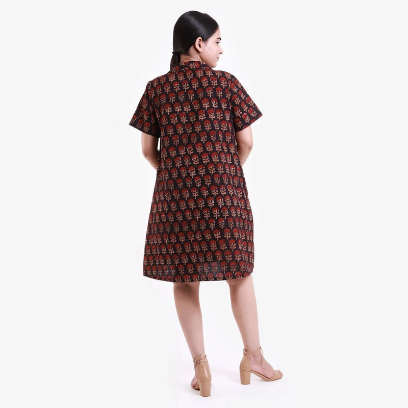 Back View of a Model wearing Black Block Print Cotton Knee Length Shirt Dress