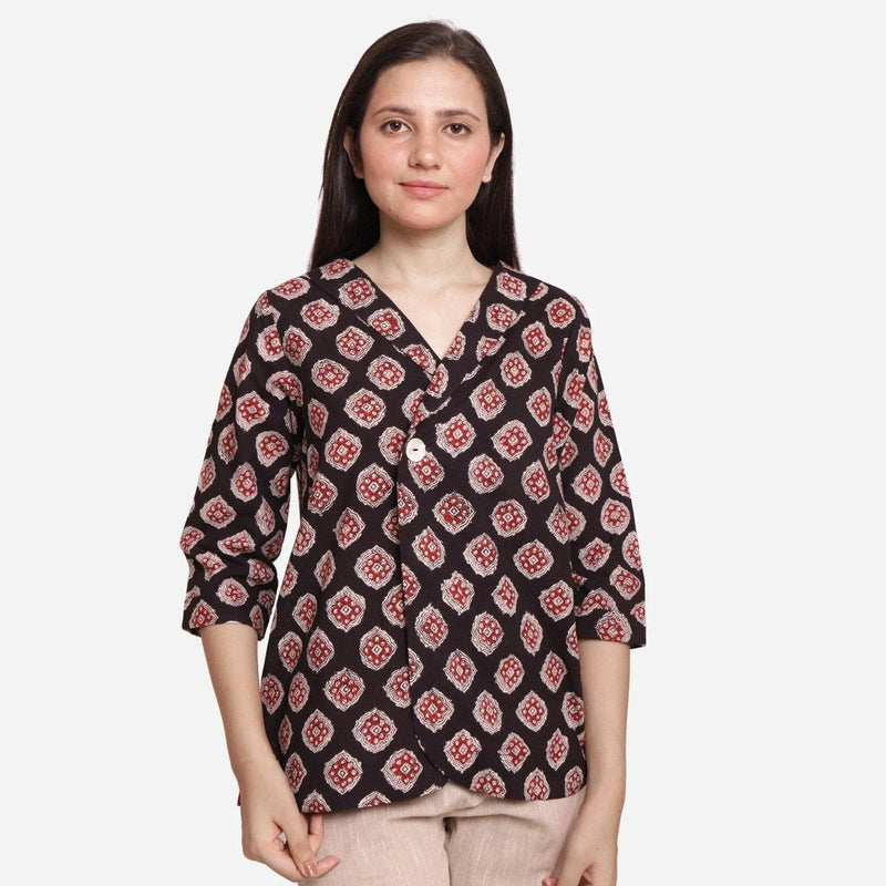 Front View of a Model wearing Black Bagru-Printed Shawl Collar Top