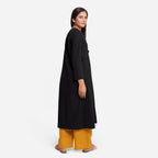 Back View of a Model wearing Black Cotton Flax Mid-Calf Length A-Line Jacket