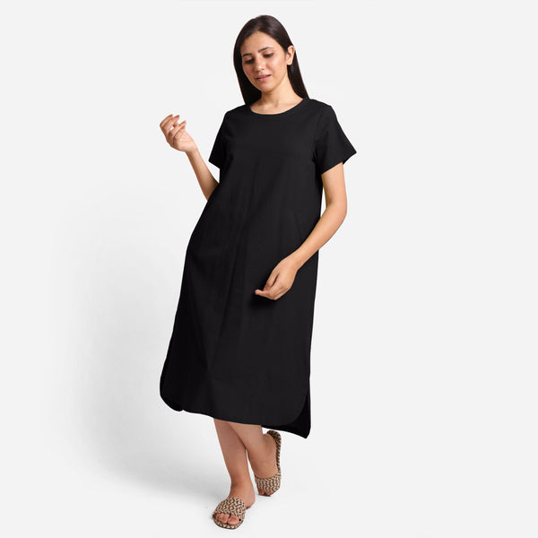 Front View of a Model wearing Black Cotton Welt Pocket Shift Dress