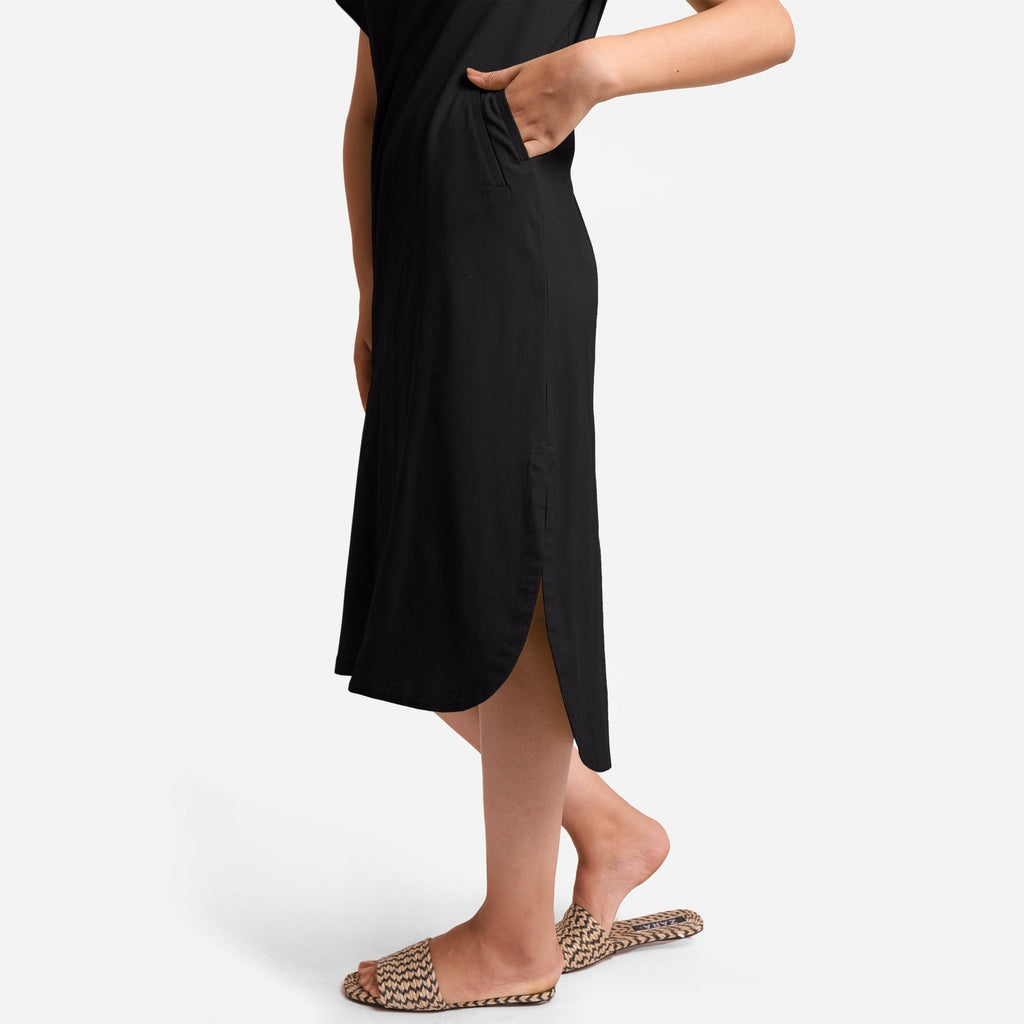 Left Detail of a Model wearing Black Cotton Welt Pocket Shift Dress