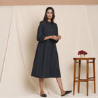 Right View of a Model wearing Black Warm Cotton Flannel Peter Pan Midi Dress