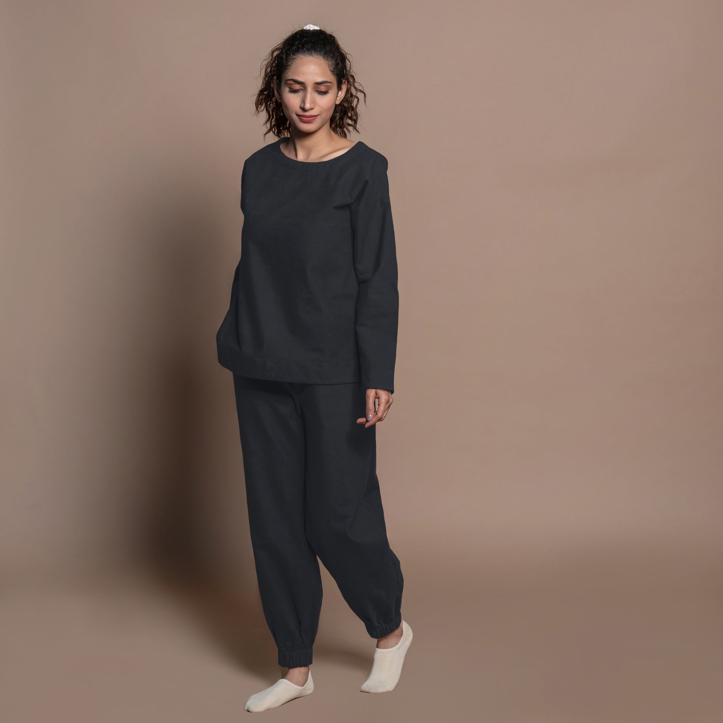 Front View of a Model wearing Black Warm Cotton Flannel Elasticated High-Rise Jogger Pant