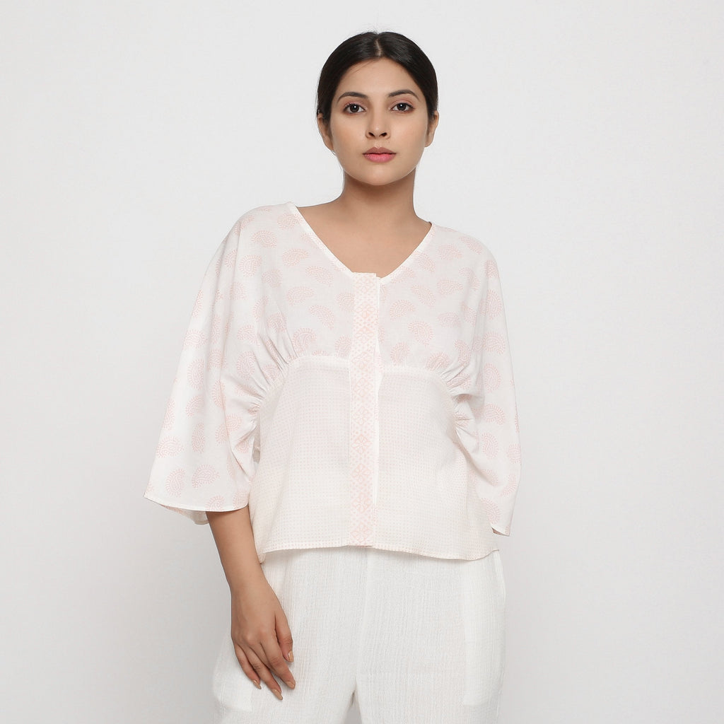 Front View of a Model wearing Pink Paisley Block Print Cotton V-Neck Blouse
