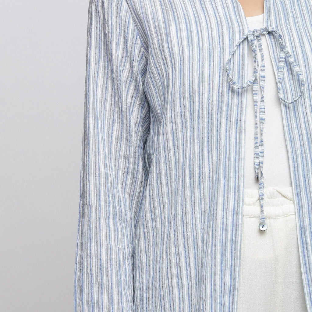 Front Detail of a Model wearing Blue and White Striped V-Neck Shrug
