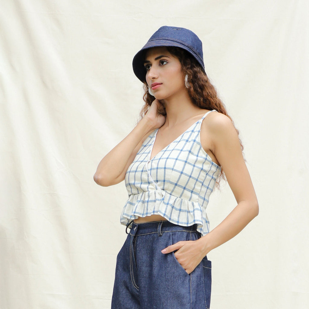 Left View of a Model wearing Blue and Off-White Checks Vegetable Dyed Handspun Cotton Peplum Wrap Top