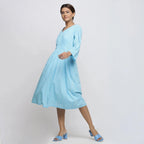 Left View of a Model wearing Blue Tie-Dye Cotton Midi Fit and Flare Dress