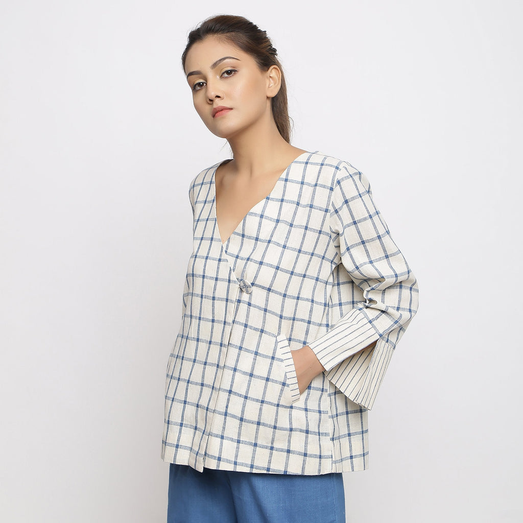 Left View of a Model wearing Off-White and Blue Vegetable Dyed Handspun Cotton Asymmetrical V-Neck Outerwear