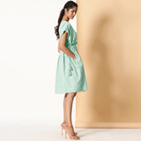 Right View of a Model wearing Bohemian Cotton Aqua Frilled Dress