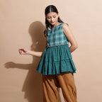 Left View of a Model wearing Bottle Green Handspun Cotton Boat Neck Tier Top