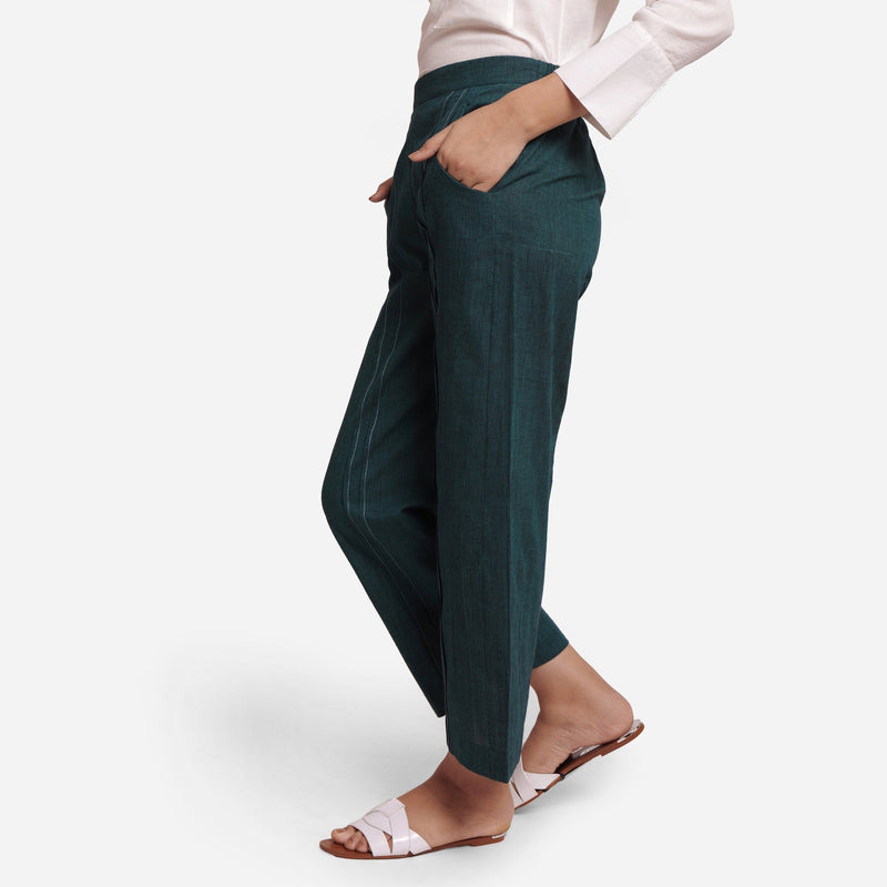 Left View of a Model wearing Bottle Green Mid-Rise Straight Fit Pant