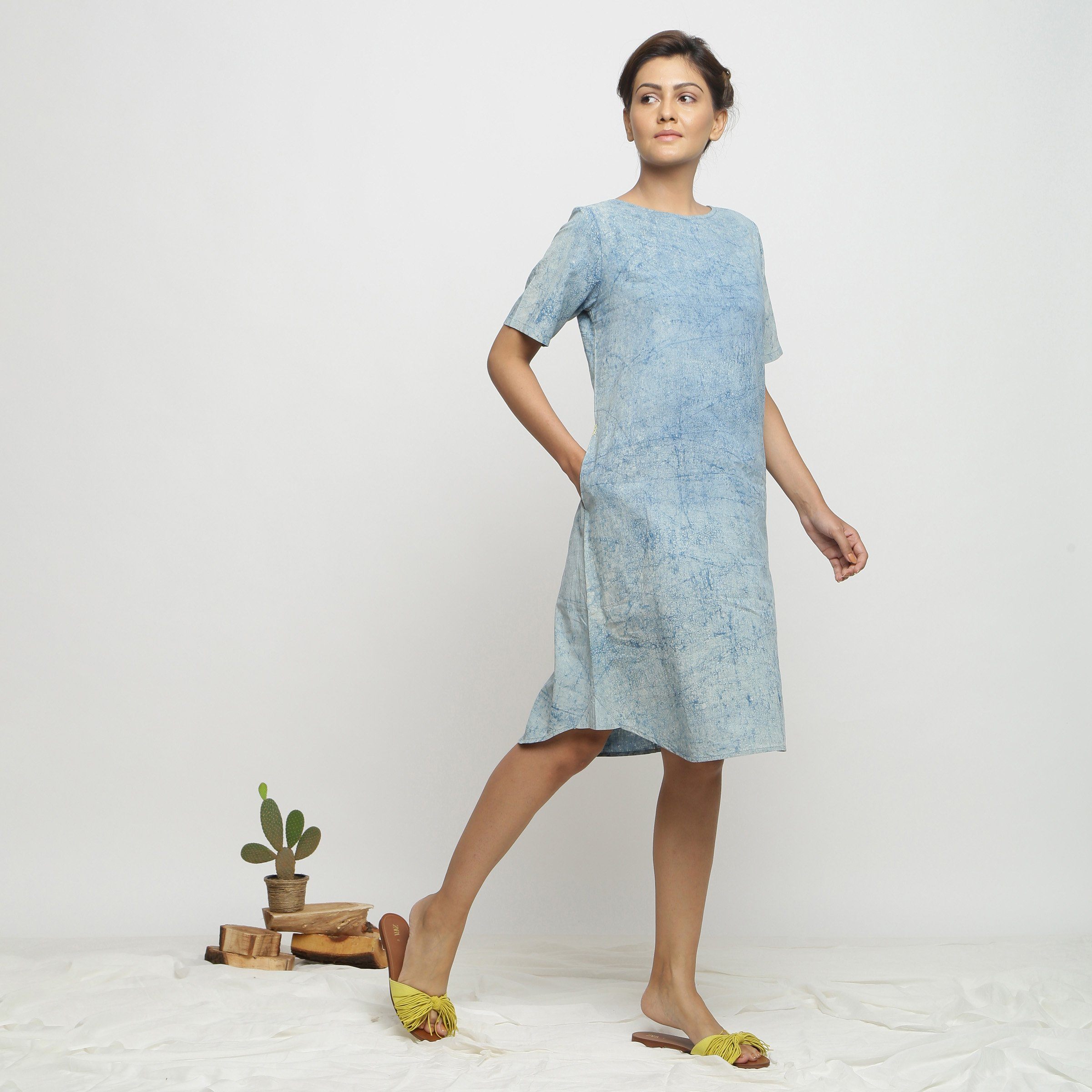 Right View of a Model wearing Blue Dabu Print Hand Embroidered Dress