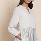 Right Detail of a Model wearing Cloudy Grey Striped Floor Length Cotton Tier Dress