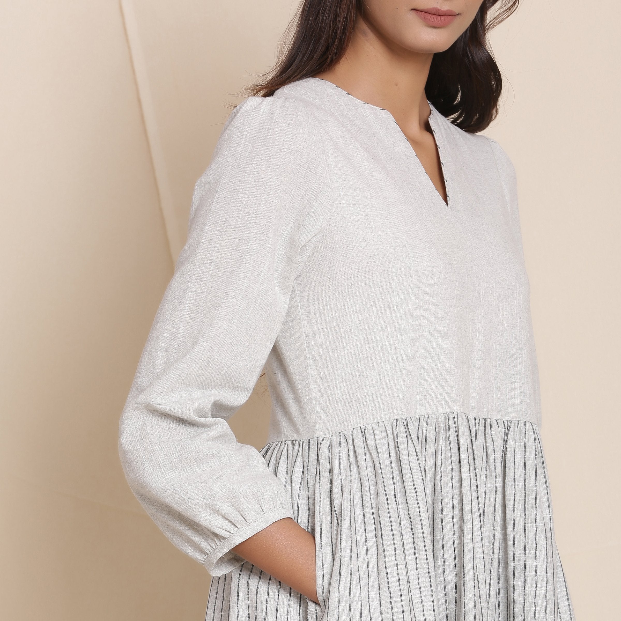 Right Detail of a Model wearing Cloudy Grey Striped Floor Length Cotton Tier Dress