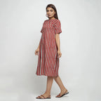 Left View of a Model wearing Brick Red Bagru Asymmetrical Midi Dress