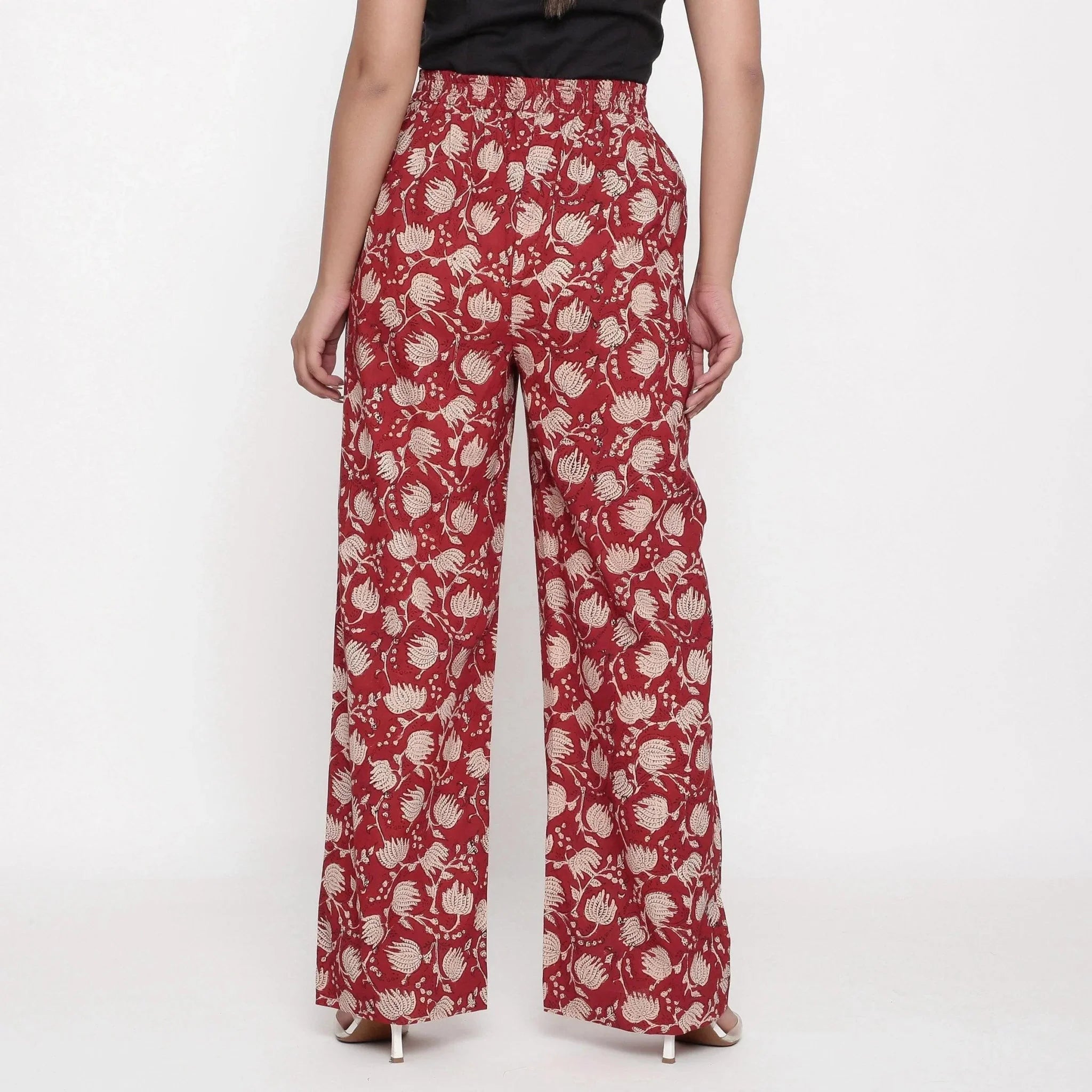 Back View of a Model wearing Brick Red Block Print Wide Straight Cotton Pant