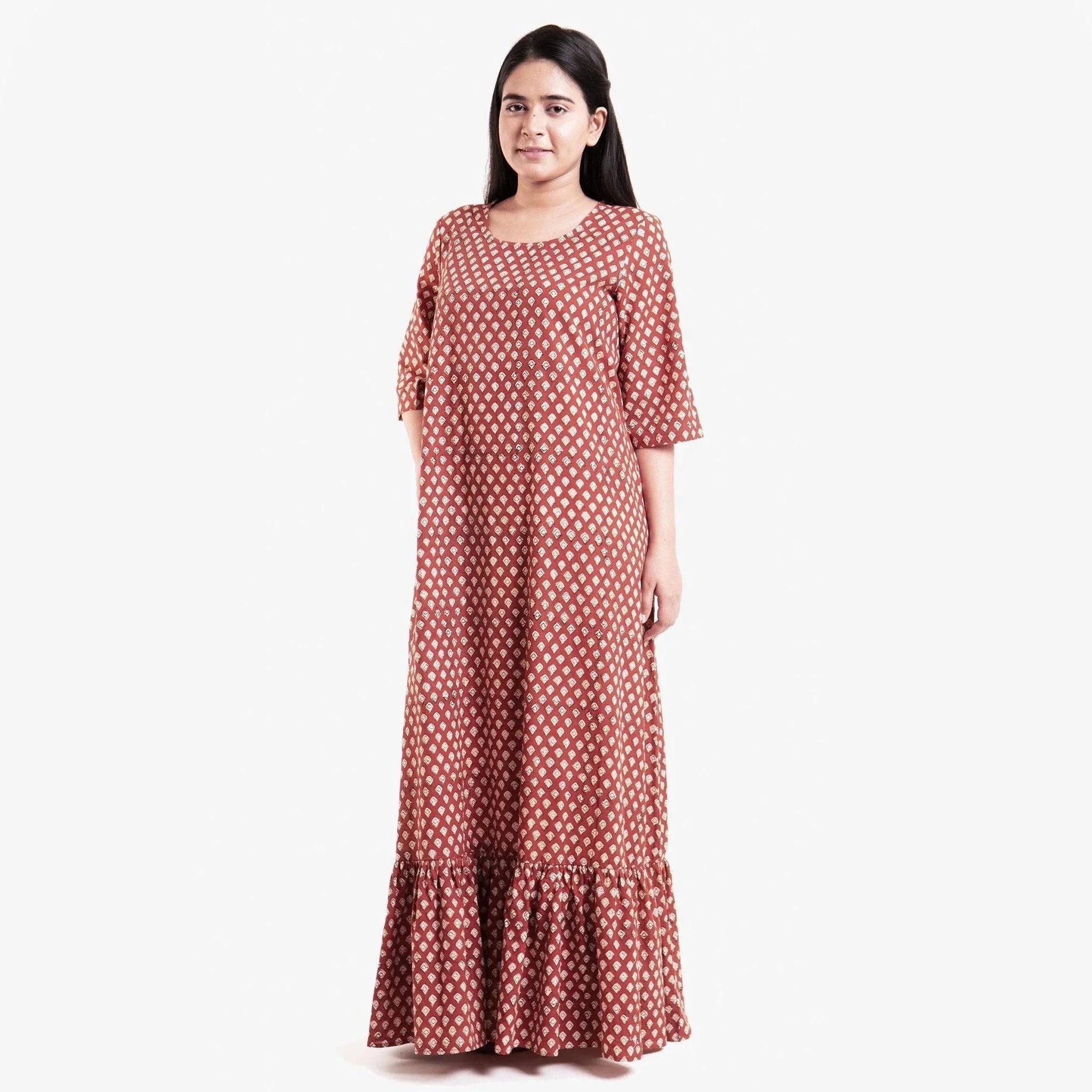 Front View of a Model wearing Brick Red Block Printed Cotton Floor Length Bohemian Dress