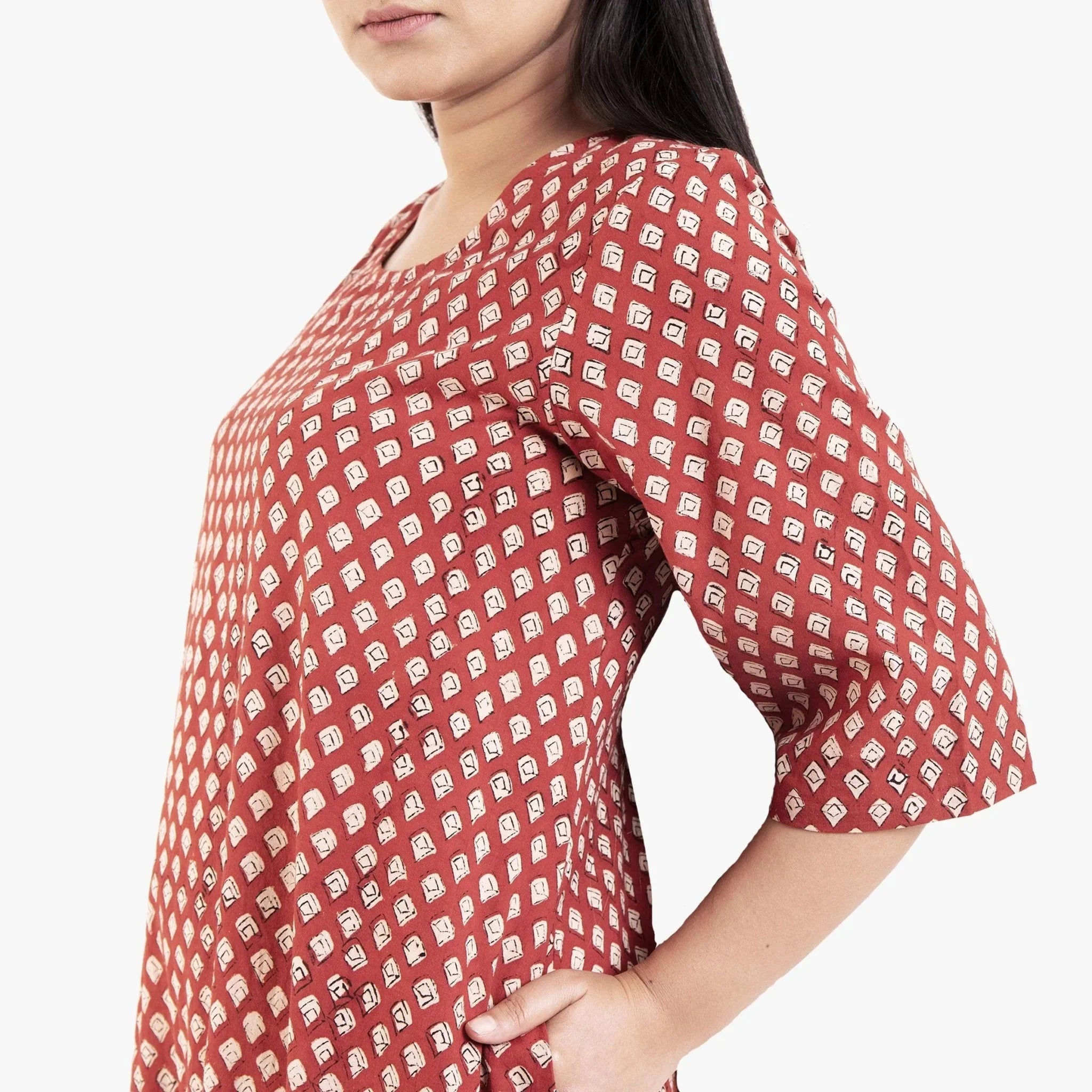 Left Detail of a Model wearing Brick Red Block Printed Cotton Floor Length Bohemian Dress