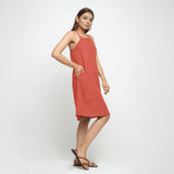Right View of a Model wearing Brick Red Criss-Cross Cotton A-Line Dress