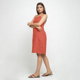 Left View of a Model wearing Brick Red Criss-Cross Cotton A-Line Dress