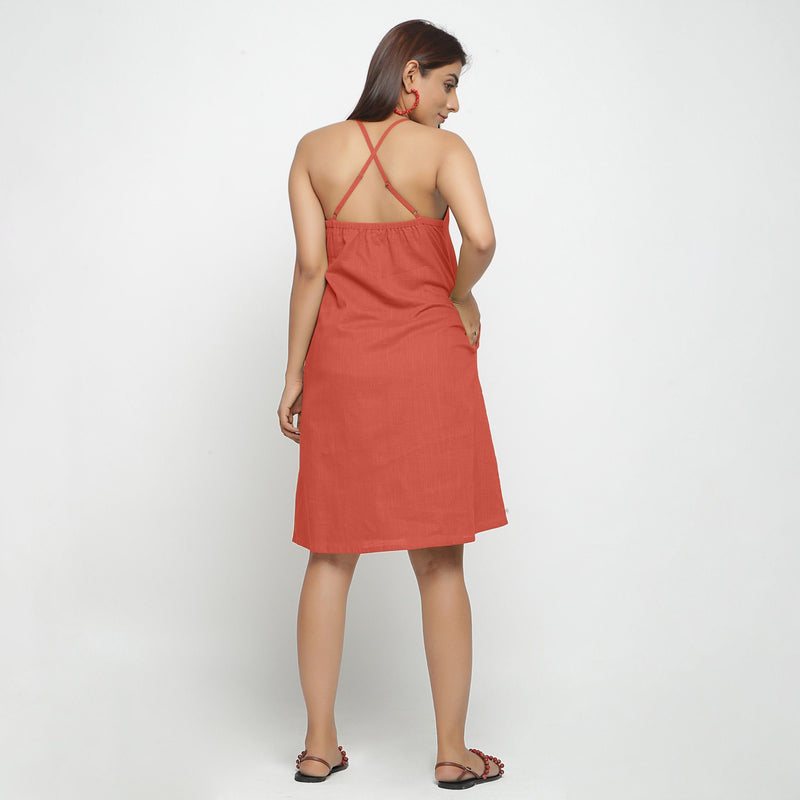 Back View of a Model wearing Brick Red Criss-Cross Cotton A-Line Dress