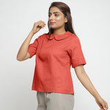 Left View of a Model wearing Brick Red Everyday Essential A-Line Top