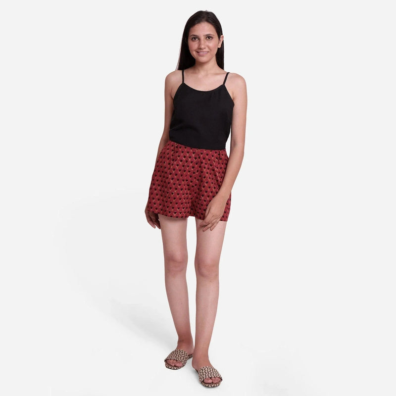 Front View of a Model wearing Brick Red Block Print Floral Hot Pants