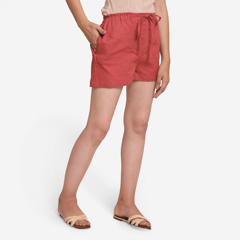Right View of a Model wearing Brick Red Cotton Straight Shorts