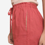 Left Detail of a Model wearing Brick Red Cotton Straight Shorts