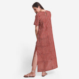 Back View of a Model wearing Brick Red Block Printed Maxi Dress