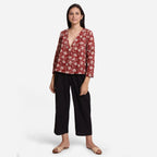 Front View of a Model wearing Floral Bagru Print V-Neck Wrap Top