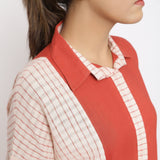 Front Detail of a Model wearing Brick Red Vegetable Dyed Cotton Button-Down Knee-Length Dress