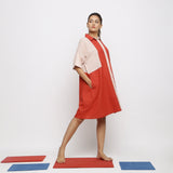 Right View of a Model wearing Brick Red Vegetable Dyed Cotton Button-Down Knee-Length Dress