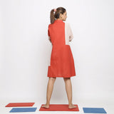 Back View of a Model wearing Brick Red Vegetable Dyed Cotton Button-Down Knee-Length Dress