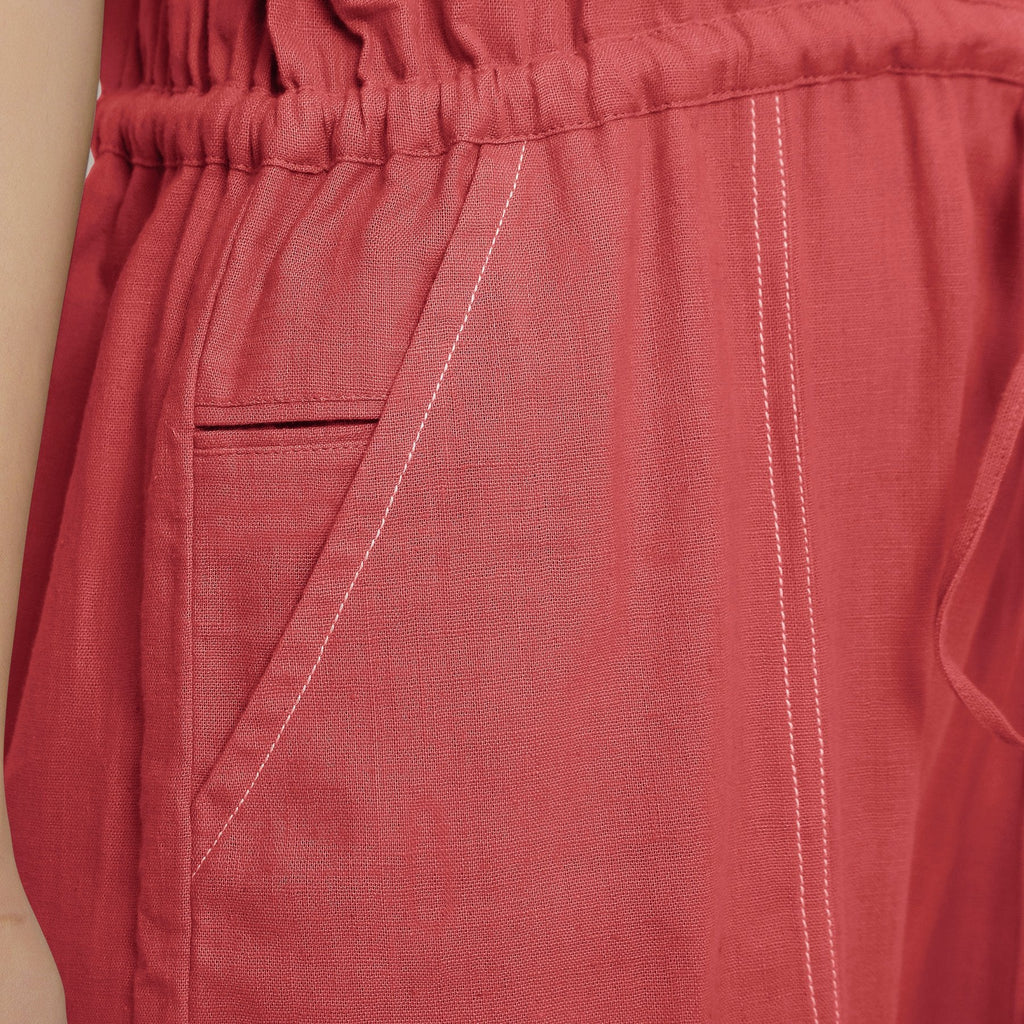 Front Detail of a Model wearing Brick Red Vegetable Dyed Button-Down Jumpsuit