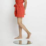 Left View of a Model wearing Brick Red Vegetable Dyed Handspun Short Shorts