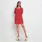 Front View of a Model wearing Brick Red Vegetable Dyed Romper