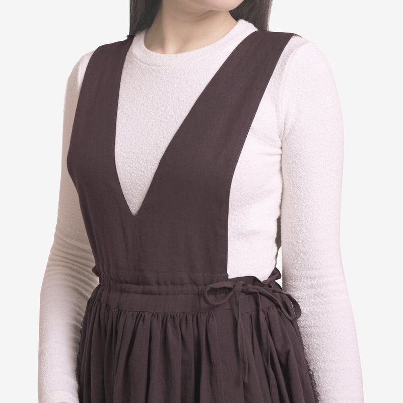 Front Detail of a Model wearing Brown Deep Neck Pinafore Midi Wrap Dress
