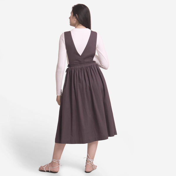Back View of a Model wearing Brown Deep Neck Pinafore Midi Wrap Dress