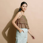 Right View of a Model wearing Brown Handspun Flared Camisole Top