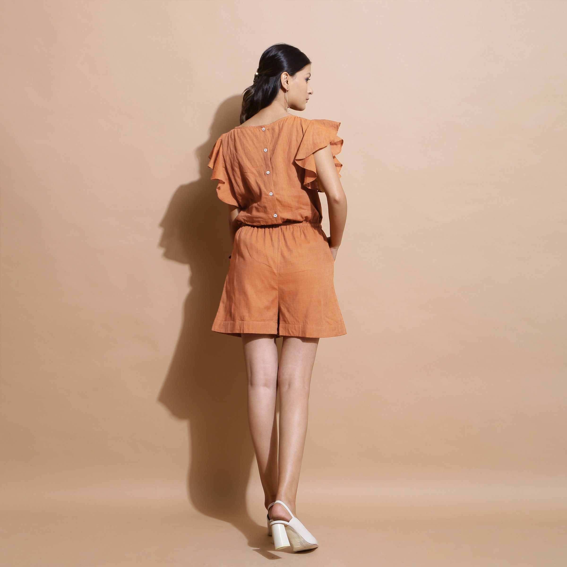 Back View of a Model wearing Brown Handspun Solid Cotton Playsuit