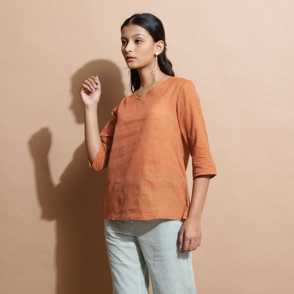 Left View of a Model wearing Brown Handspun Split-Neck Straight Top