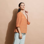 Right View of a Model wearing Brown Handspun Split-Neck Straight Top