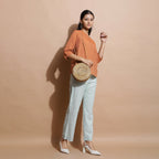Right View of a Model wearing Brown Handspun Split-Neck Straight Top