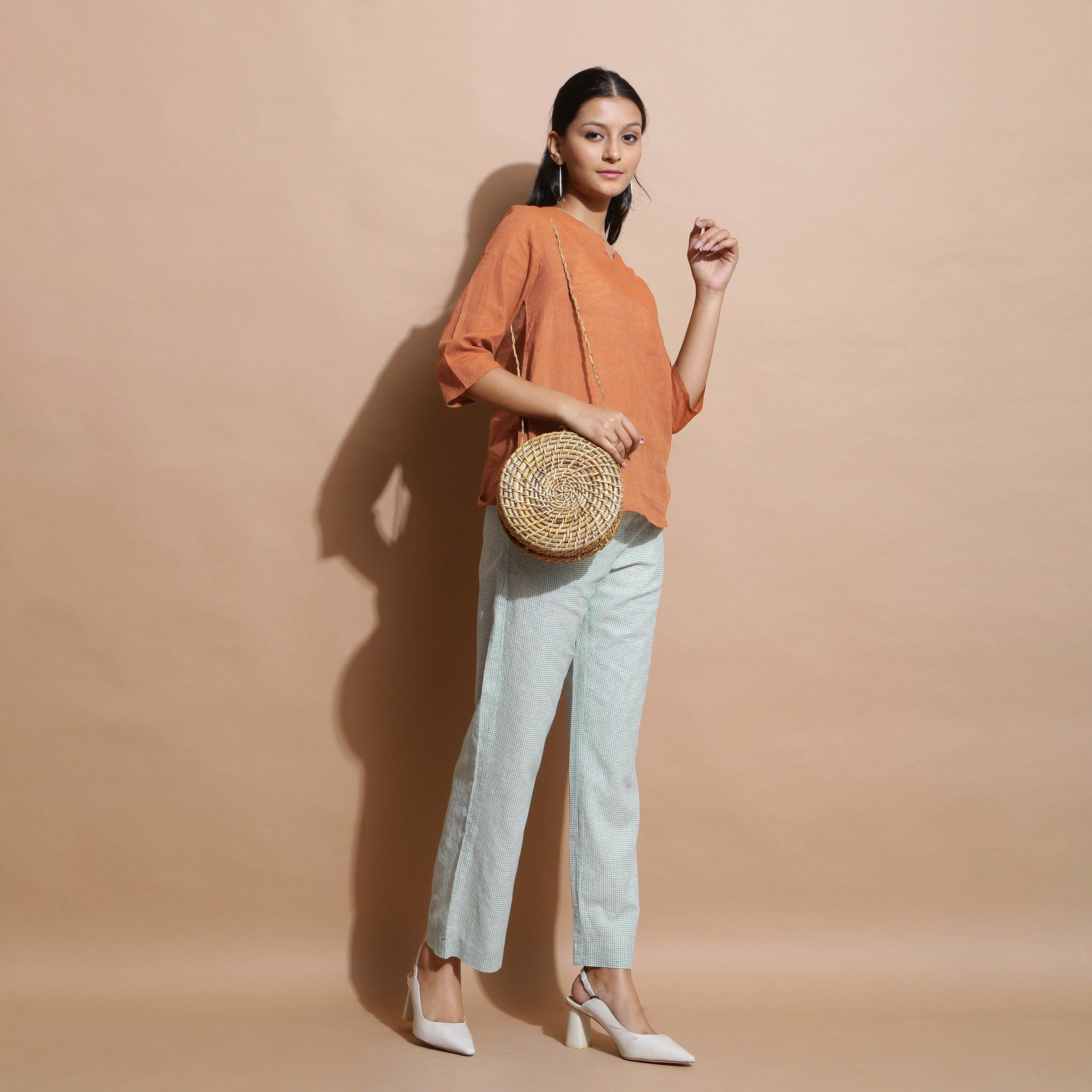 Right View of a Model wearing Brown Handspun Split-Neck Straight Top