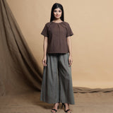 Front View of a Model wearing Brown Pleated Neck A-Line Top