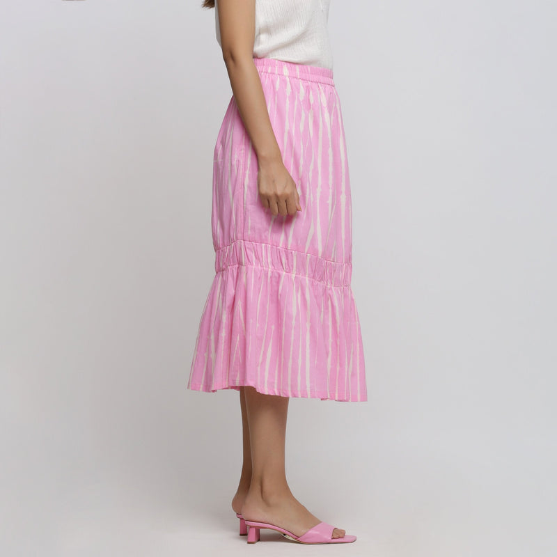 Right View of a Model wearing Bubblegum Pink Tie-Dye Cotton Elasticated Midi Balloon Skirt