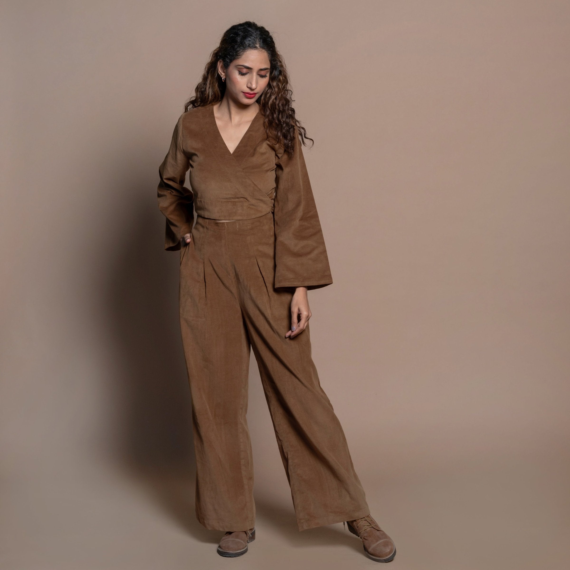 Front View of a Model wearing Camel Brown Cotton Velvet Elasticated Wide Legged Pant