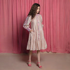 Right View of a Model wearing Champagne Chanderi Cotton Block Print Knee Length Dress